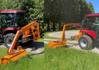 Two tractors side by side, one equipped with a blade attachment.